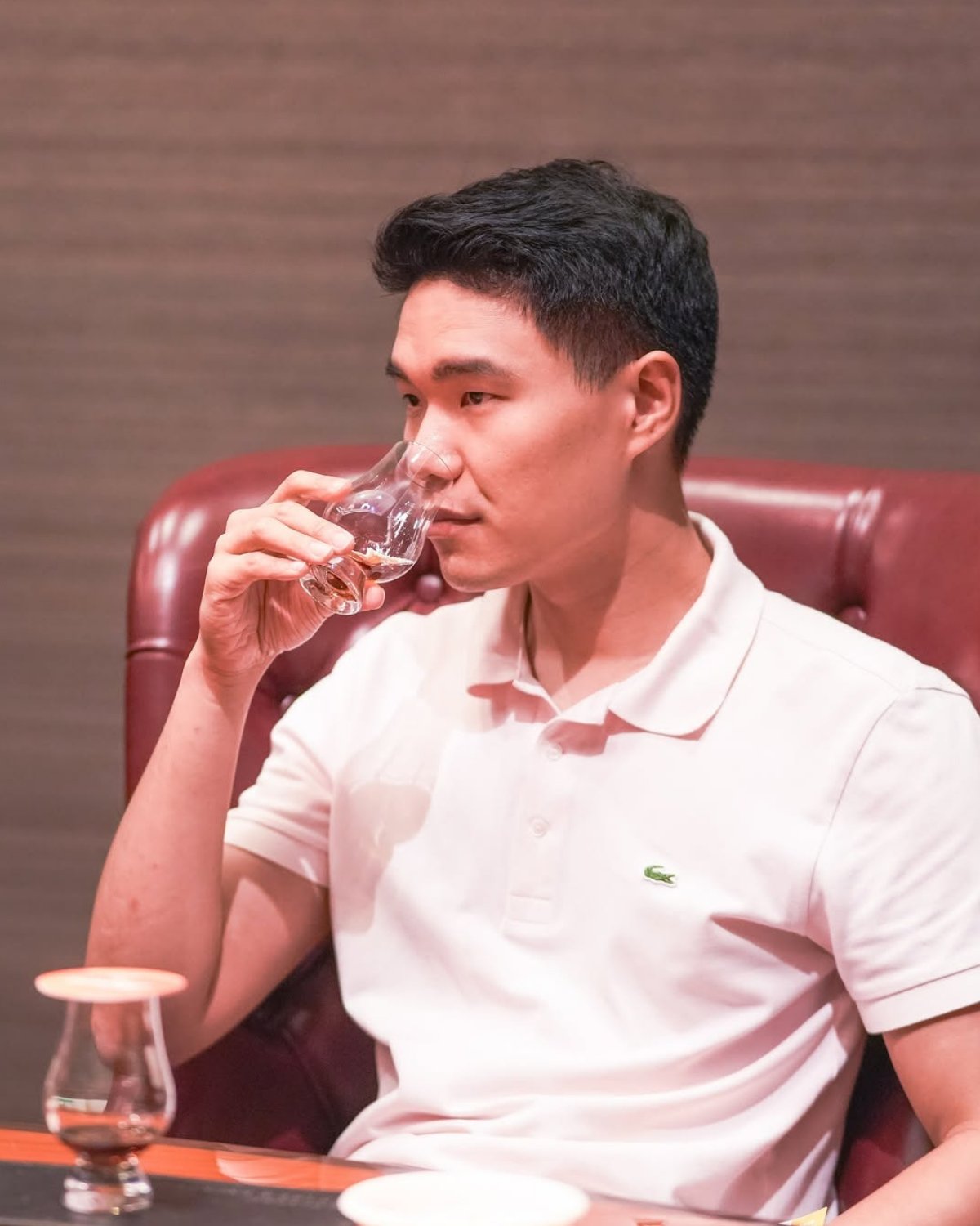A guest nosing a glass of whisky
