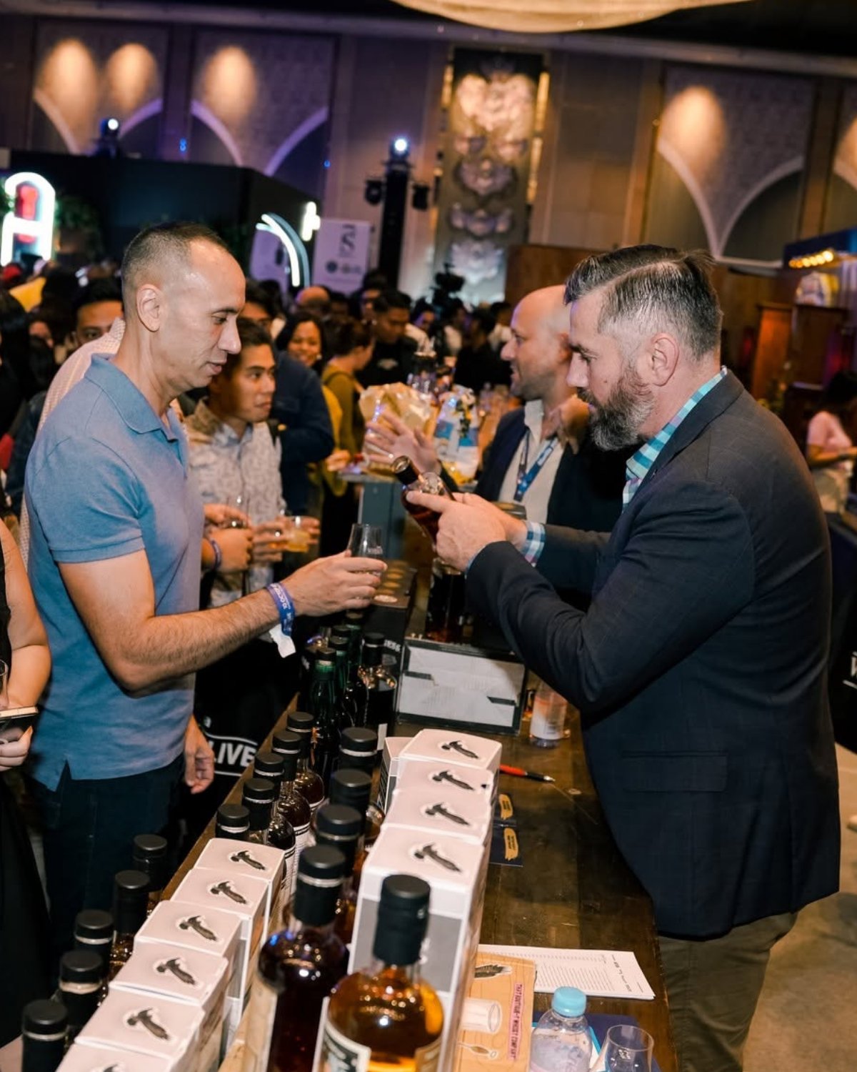 A brand ambassador pouring for a guest
